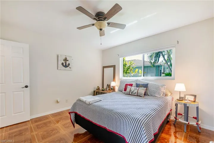 Bedroom featuring baseboards and a ceiling fan