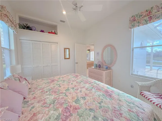 Bedroom featuring ceiling fan and a closet