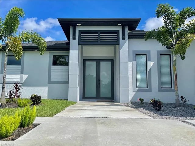 Entrance to property featuring french doors
