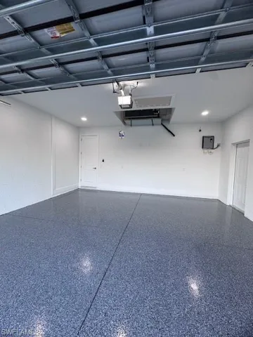 Garage featuring a garage door opener
