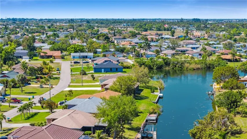 Drone / aerial view with a residential view and a water view