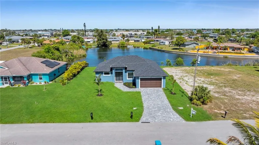 Birds eye view of property featuring a residential view and a water view