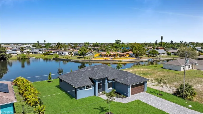 Aerial view with a water view and a residential view