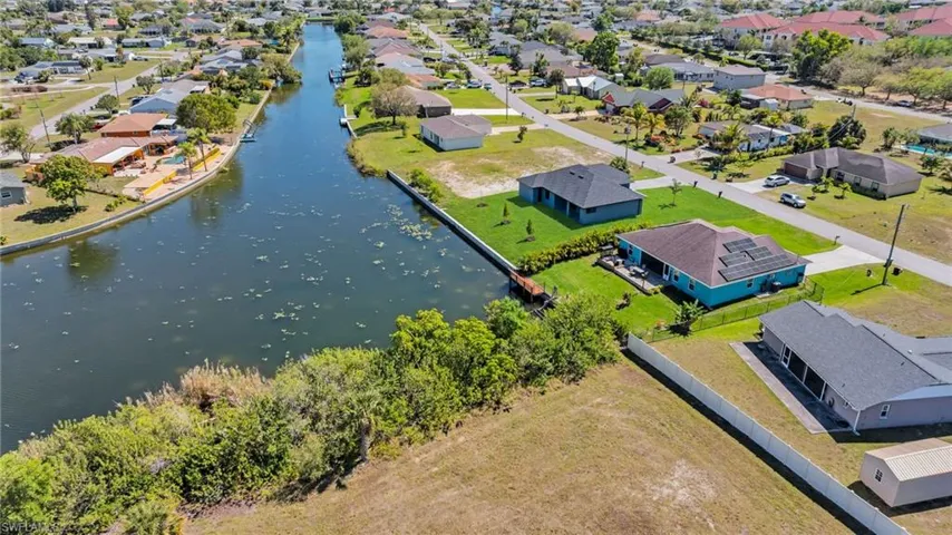 Drone / aerial view featuring a residential view and a water view