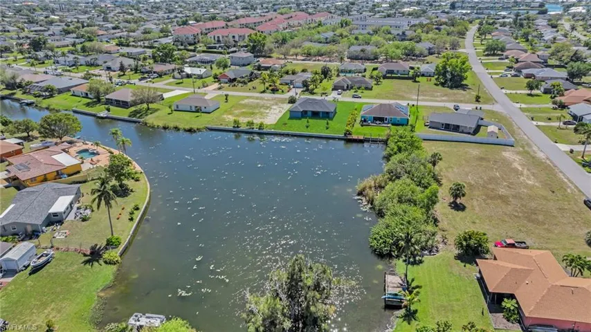 Bird's eye view with a water view and a residential view