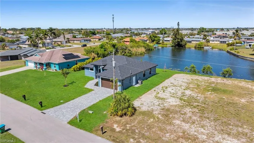 Aerial view with a water view and a residential view