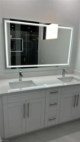 Bathroom featuring vanity and walk in shower