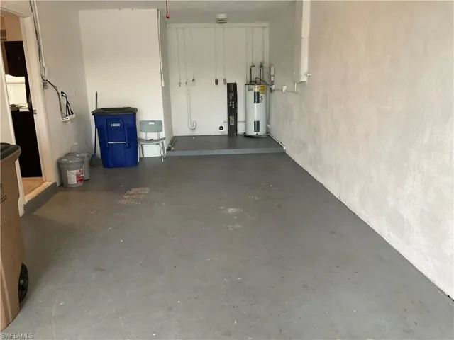 Garage featuring water heater