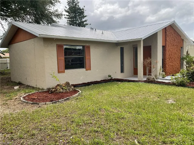 Ranch-style home with a front yard