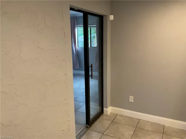 Corridor with light tile floors