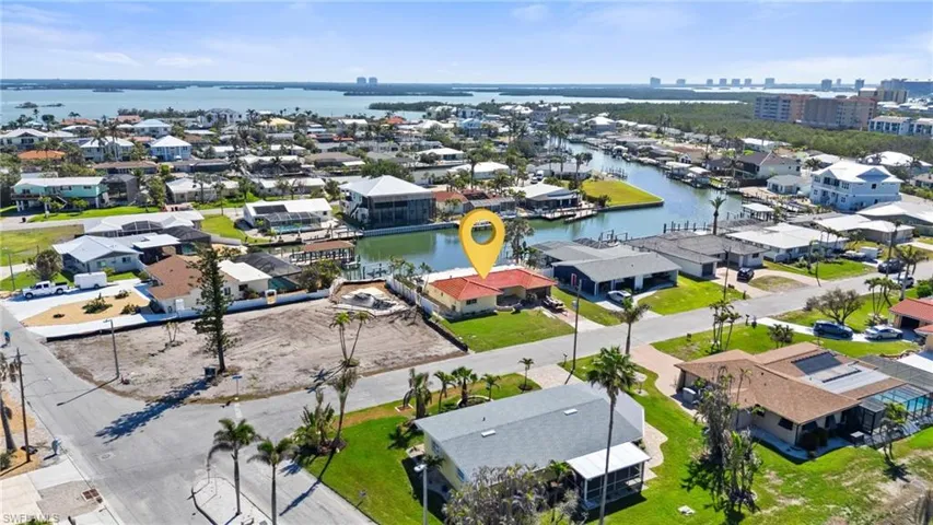 Birds eye view of property with a residential view and a water view  - Virtually Edited Image
