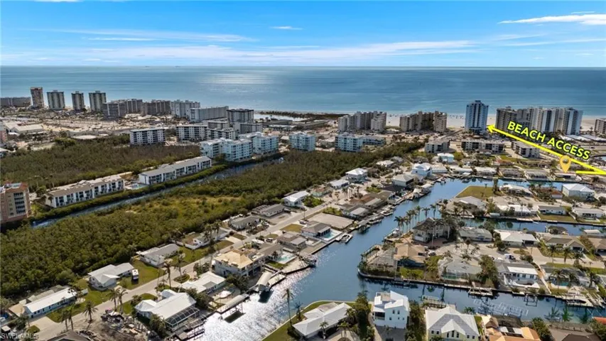 Drone / aerial view featuring a water view and a view of city  - Virtually Edited Image