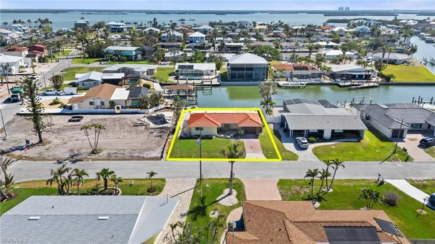 Aerial view featuring a water view and a residential view  - Virtually Edited Image