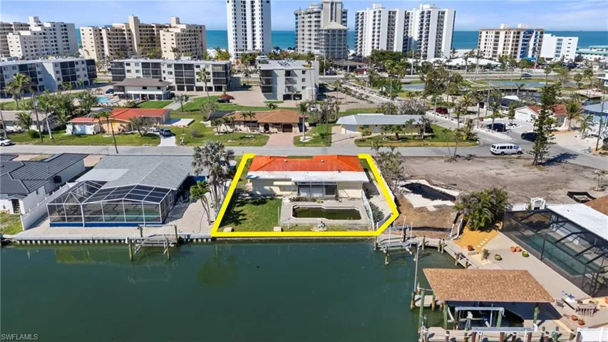 Drone / aerial view with a water view and a city view  - Virtually Edited Image