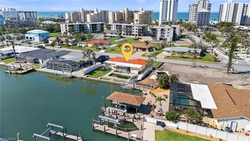 Aerial view featuring a water view and a view of city  - Virtually Edited Image