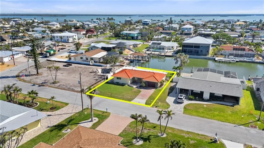 Birds eye view of property featuring a residential view and a water view  - Virtually Edited Image