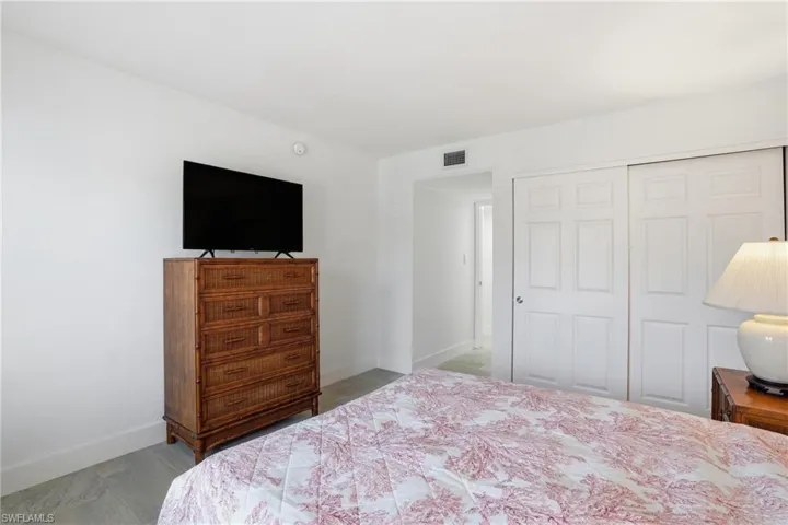 Bedroom with baseboards and a closet - Virtually Edited Image