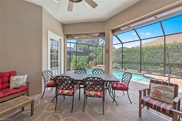 Sunroom with plenty of natural light and ceiling fan
