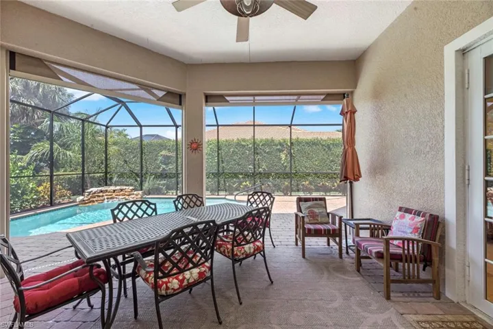 Sunroom / solarium featuring ceiling fan