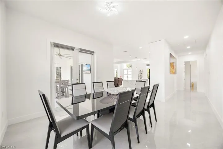 Dining room with recessed lighting and baseboards