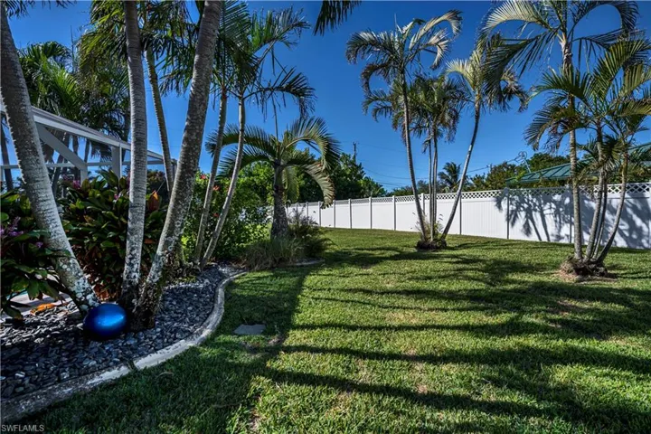 Large fenced yard with beautiful landscape