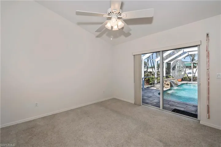 Guest Bedroom with Sliders to Pool Area