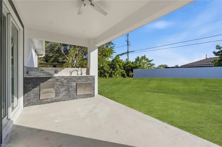 View of patio / terrace featuring area for grilling and a ceiling fan