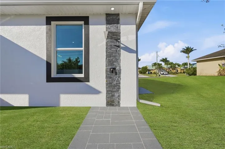 Exterior view of stone siding and stucco siding