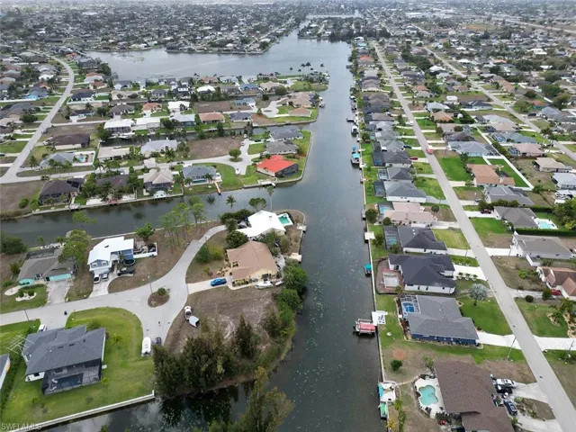 Aerial overview of property's location featuring nearby suburban area