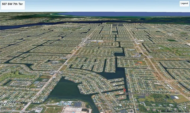 Aerial overview of a residential area featuring numerous waterways and a dense network of streets
