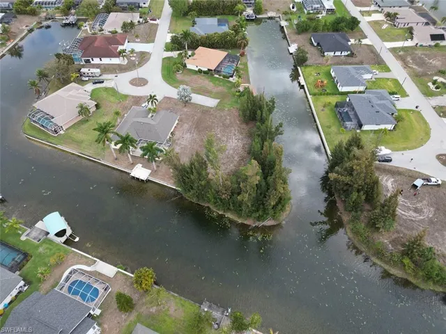 View of property location with nearby suburban area and a nearby body of water