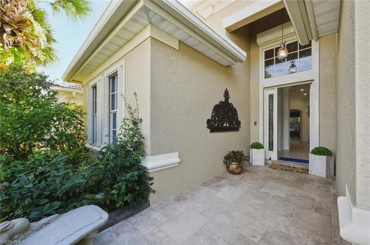 Property entrance with stucco siding