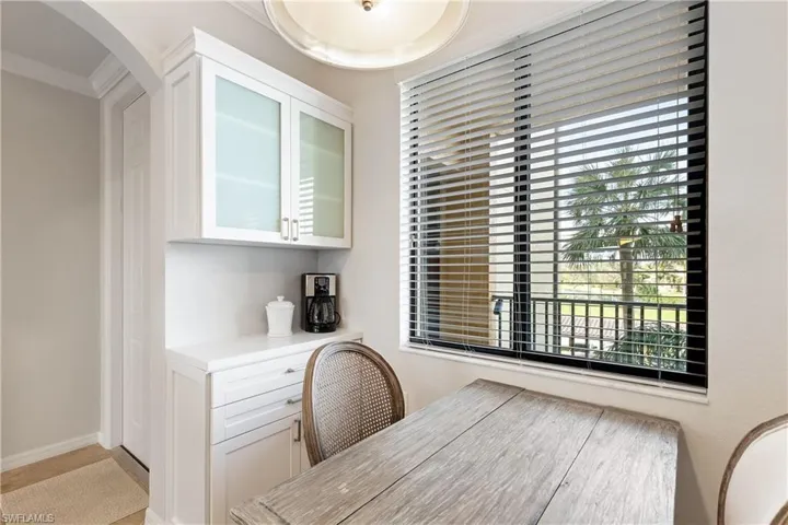 Office space with crown molding and a healthy amount of sunlight