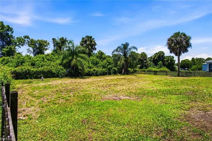 Expansive lot with green space and perimeter fencing