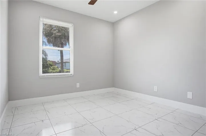 Neutral gray wall paint complementing white baseboards