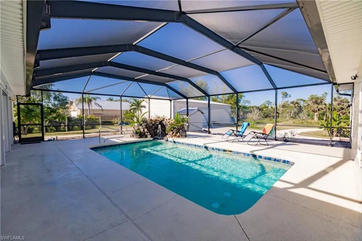View of pool featuring a patio and a lanai