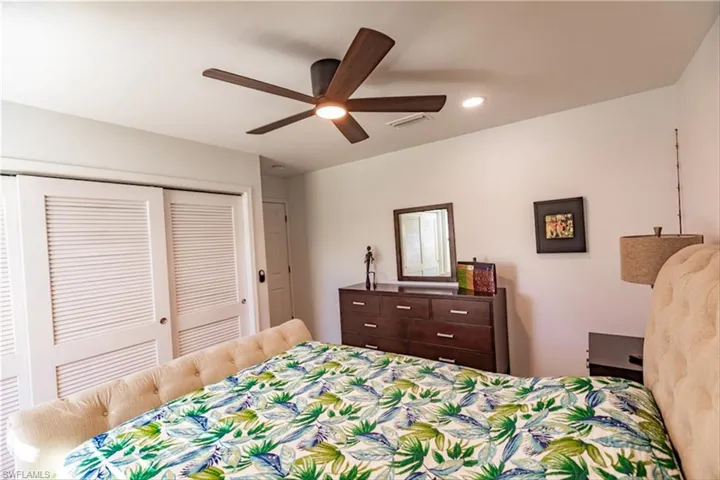 Bedroom with a closet and ceiling fan