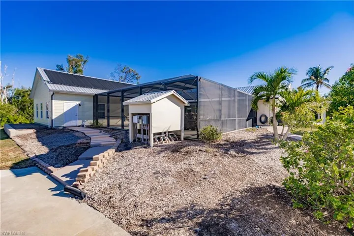 View of front of house featuring glass enclosure