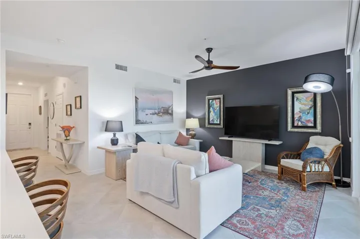 Living room featuring ceiling fan
