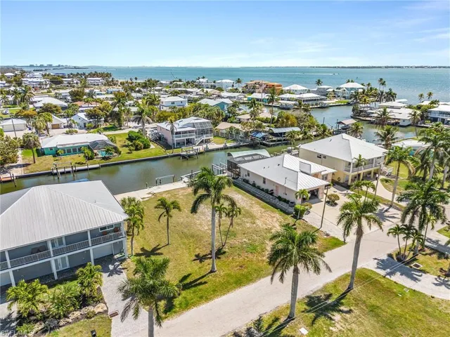 Aerial perspective of suburban area with a large body of water