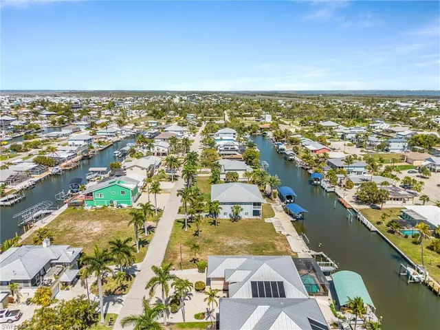 Aerial perspective of suburban area with a large body of water
