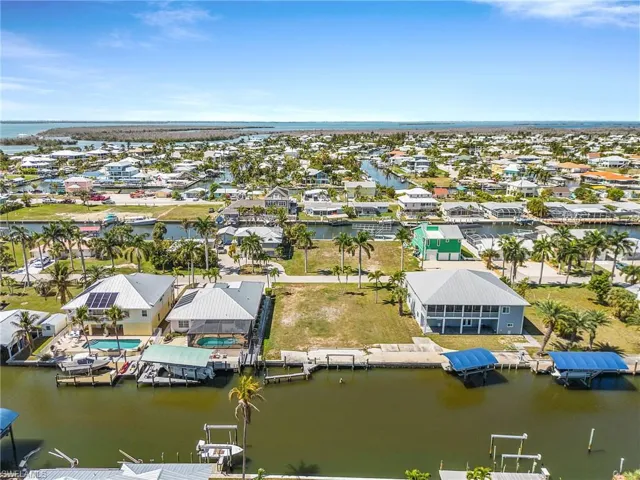 Aerial view of residential area featuring a large body of water