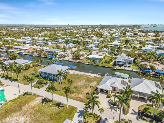 Aerial perspective of suburban area with a nearby body of water