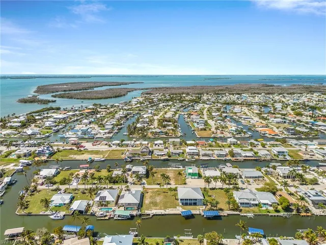 Aerial view of residential area with a large body of water