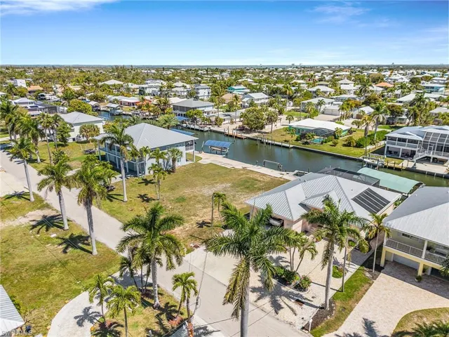 Aerial view of residential area with a large body of water