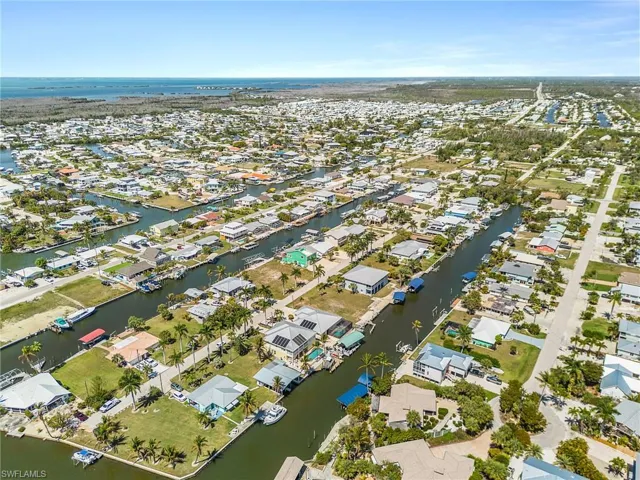 Aerial overview of property's location featuring nearby suburban area