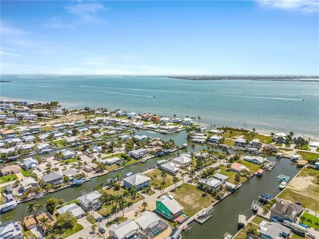 Aerial perspective of suburban area with a nearby body of water