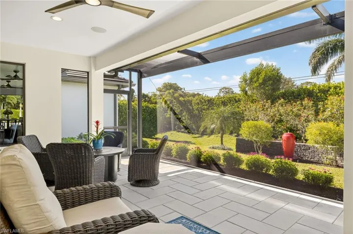 Extended screend lanai featuring recessed lighting, built in speakers, and beautiful sunset views