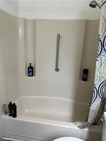 Bathroom with vanity and dark wood-style flooring