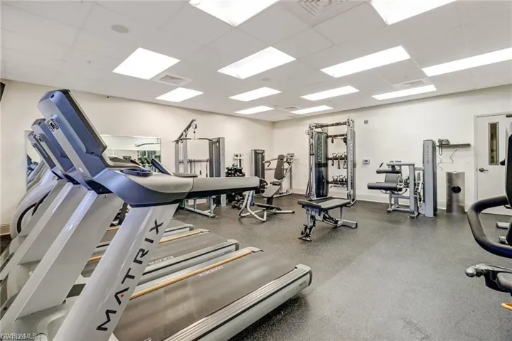 Workout area featuring a paneled ceiling